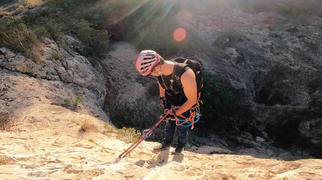 Man rock climbing aerial view of sportsman rapelling mountain in La Panocha, el Valle Murcia, Spain woman rapel down a mountain climbing a big rock