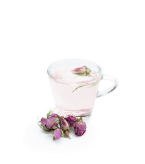 Rose buds tea in a small cup isolated on white