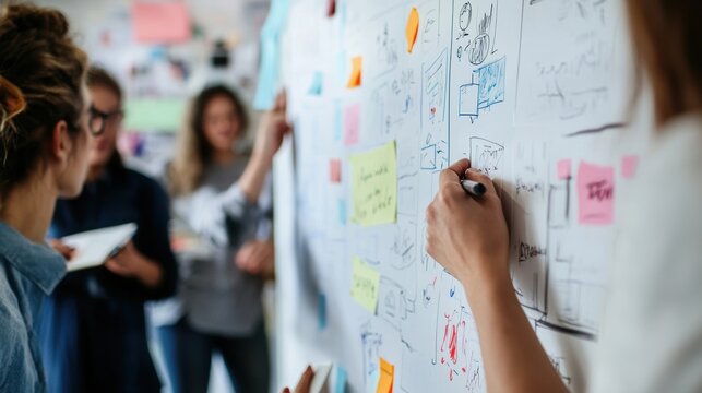 Group of young creative people brainstorming during meeting