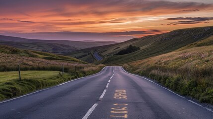 Fototapeta premium Winding Road Through Hills at Sunset: Beautiful Vistas and Calm Scenery