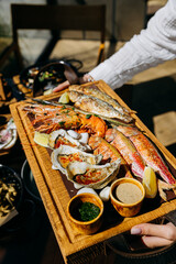 Seafood platter with shrimp, grilled fish, oysters. Menu design, food advertising, culinary projects