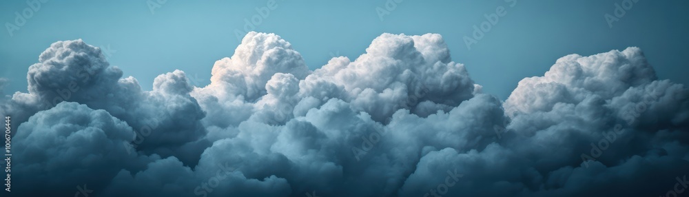 Poster dramatic cloud formations fill the sky, creating a stunning backdrop of texture and depth, ideal for