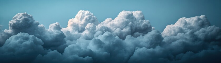 Dramatic cloud formations fill the sky, creating a stunning backdrop of texture and depth, ideal for nature-themed projects and backgrounds.
