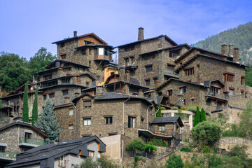 stone houses among the trees on the mountain