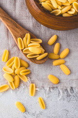 Malloreddus or gnocchi  or gnocchetti Sardi pasta,  Italian pasta from island  Sardinia. Italian cuisine, Sardinian pasta,  rustic style