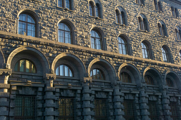 architectural background, dark facade of an old city building, barely illuminated by the morning...