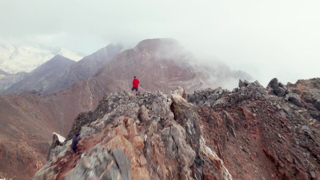 Epic ascent in 4K: Trekking to Argualas Peak and Algas with mountaineers climbing, captured from the air in the Panticosa Valley, with views of Garmo Negro and Los Infiernos in the Aragonese Pyrenees.