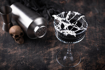 Halloween cocktail with spider cobweb