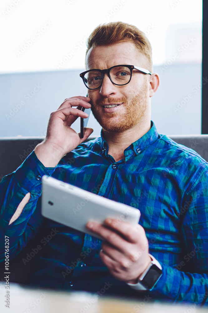 Aufkleber portrait of happy smiling man looking at camera during positive smartphone conversation with friend 