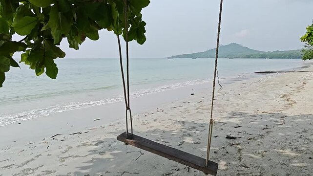 makeshift swing on a beach in koh mook