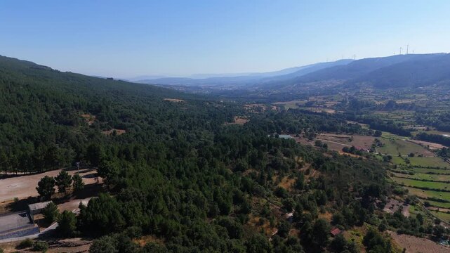 Aerial view of Vila Pouca de Aguiar, showcasing vast green valleys and distant mountains
