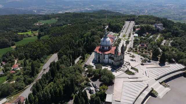 Aerial view of the Sanctuary of Sameiro in Braga, Portugal, with a vast forest and surrounding hills