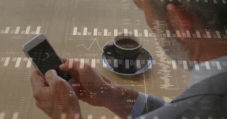 Image of financial data processing over caucasian businessman using smartphone