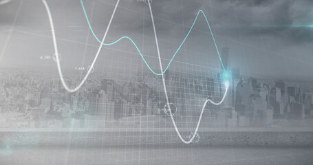 Image of light spots and diagrams over cityscape
