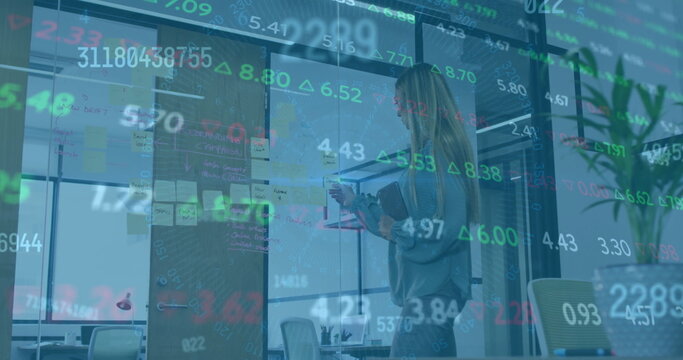 Image of financial data processing over biracial businesswoman working in office