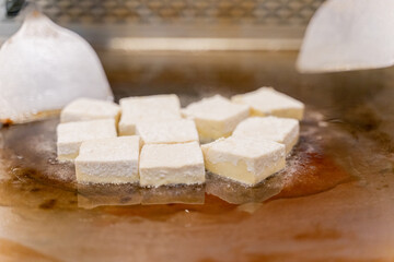 The fragrant Teppanyaki tofu is being prepared for each dish