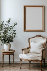 A simple white wall with an empty wooden frame hanging on it, with a classic armchair and side table beside the chair. 