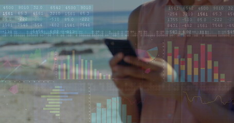 Image of data processing and diagrams over caucasian woman using on smartphone at beach