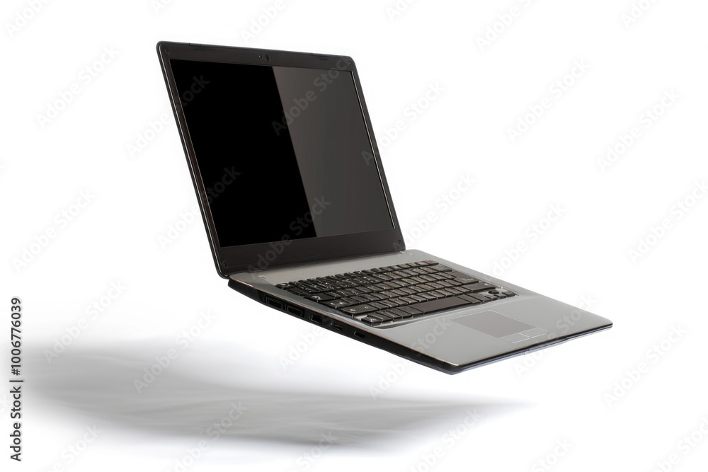 Poster A laptop computer is open and sitting on a white surface, ready for use