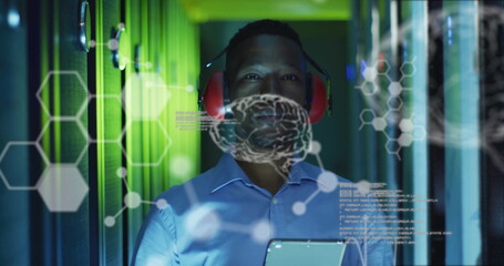 Image of data processing with brains over african american businessman in server room