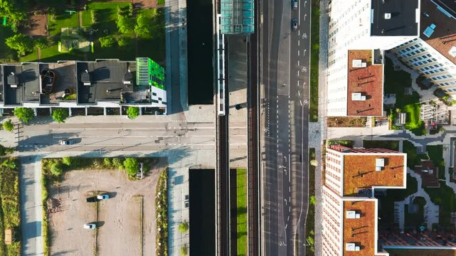 Aerial top down view of train depart from Orestad station, Copenhagen