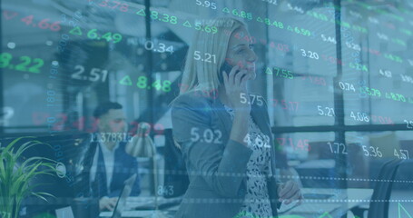 Image of financial data processing over caucasian businesswoman using smartphone in office