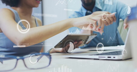 Image of financial data processing over diverse colleagues discussing work in office