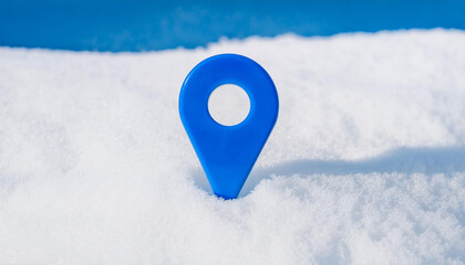 Blue location pin on white snow. Winter season. Travel and nature concept. GPS, guidance, direction