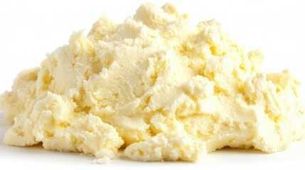 A close-up of a swirl of whipped butter, isolated on a white background, highlighting its creamy texture and fresh appearance.
