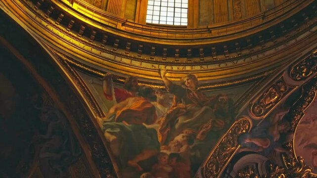 Bask in the mesmerizing beauty of ornate murals illuminated by soft, golden light in Church of the Gesu