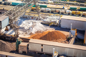 Top view of a cement plant. Workshops and compressors, equipment, metallurgy. Slag and sand and...