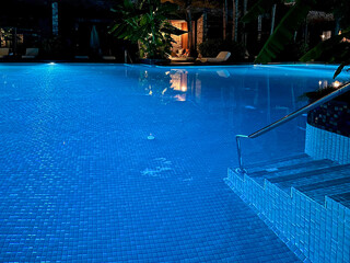Beautiful view of swimming pool with clear water at night