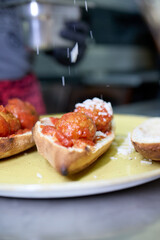 A hearty sandwich made with a pizza dough base, baked to perfection and filled with two perfectly assembled meatballs