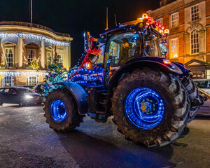 tractor on the road decorated with lights for Christmas © Robert L Parker