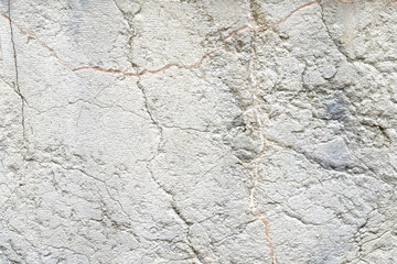 Grunge wrinkled stone wall texture with stains and dirt. Abstract rough background