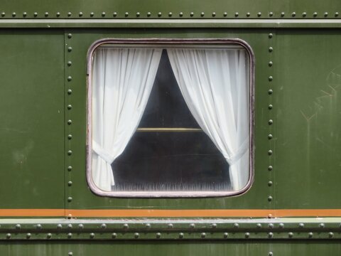 window on the wall of an old vintage train