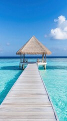 Beautiful blue sea and a wooden pier with a thatched roof on a tropical island.