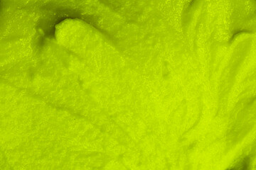 Smoothie with fresh green vegetables and fruits. Berry and yogurt ice cream. The texture of the sorbet. Delicious sweet dessert close-up as a background.