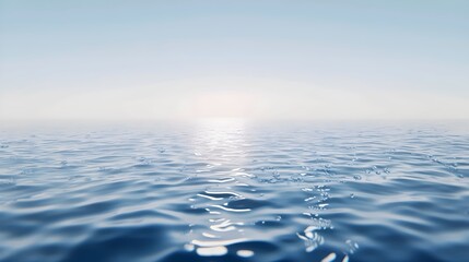 Fototapeta premium A serene view of the ocean with a hazy sky and shimmering water. The sun shines brightly above the horizon, casting a golden glow over the surface.
