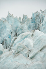 close up glacier ice in iceland. Close up blue ice with black stripes. europe extreme nature background. adventure vacation. Natural scenic