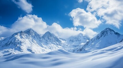 Obraz premium Winter snow mountains and blue sky with clouds in nice sun day. Caucasus Mountains, region Dombay, 