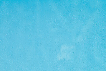 drops on water with circles on a blue background