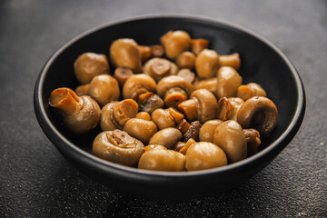 Champignon mushroom canned product tasty food dish fresh delicious gourmet food background on the table rustic food top view copy space top view keto and paleo diet Vegetarian and vegan food
