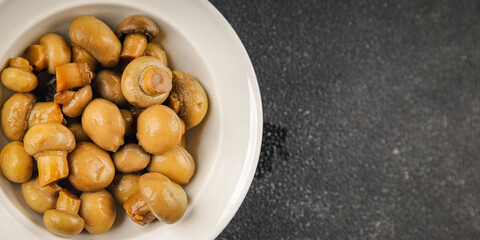Champignon mushroom canned product tasty food dish fresh delicious gourmet food background on the table rustic food top view copy space top view keto and paleo diet Vegetarian and vegan food