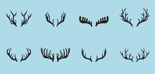 Deer antlers collection isolated on blue background.