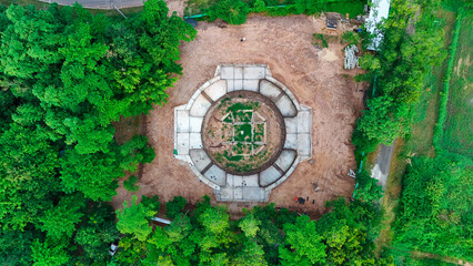A Thai temple in Prakhon Chai district is surrounded by a verdant garden.