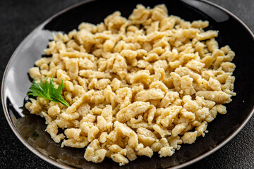 spaetzle egg pasta shape fresh meal food snack on the table copy space food background rustic top view