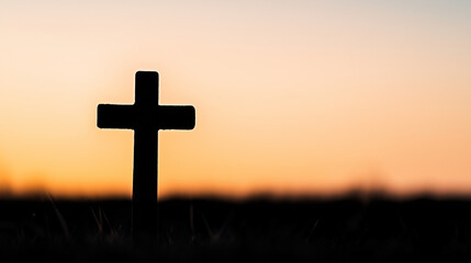 Cross against sunset background. Catholic stock photo.