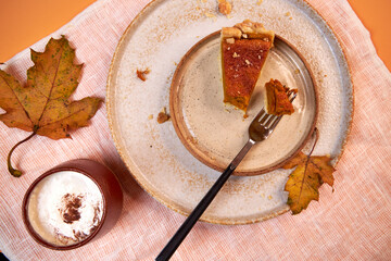 pumpkin pie, pumpkin pie slices on a peach background top view