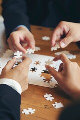 Collaborate between Professional Businessman and Partnership. Group of Business people holding piece of jigsaw puzzle to solution problem during brainstorming meeting -vertical image.